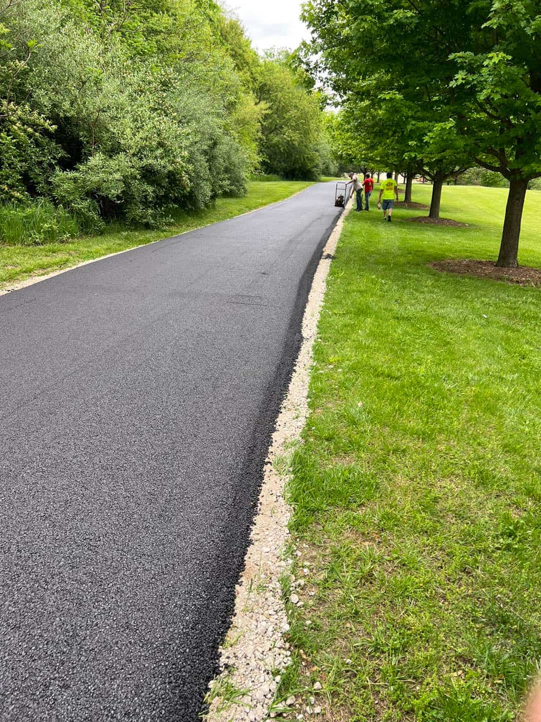 Fresh paved pathway with clean gravel edge by Original Asphalt