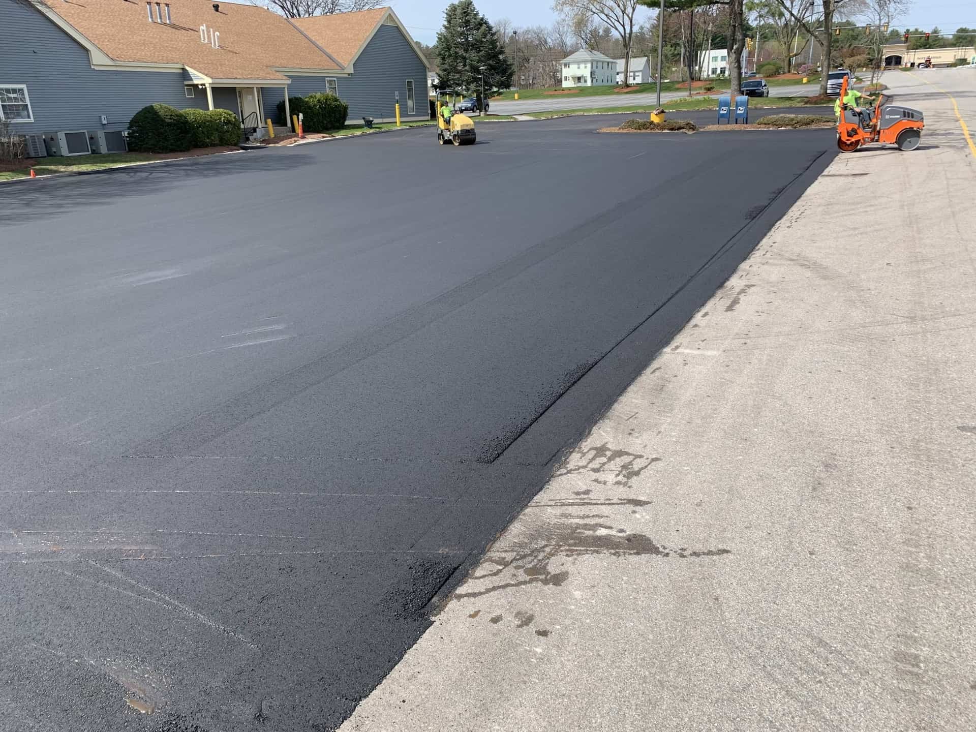 Parking lot asphalt repair with roller equipment